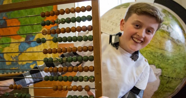 child holding abacus 2